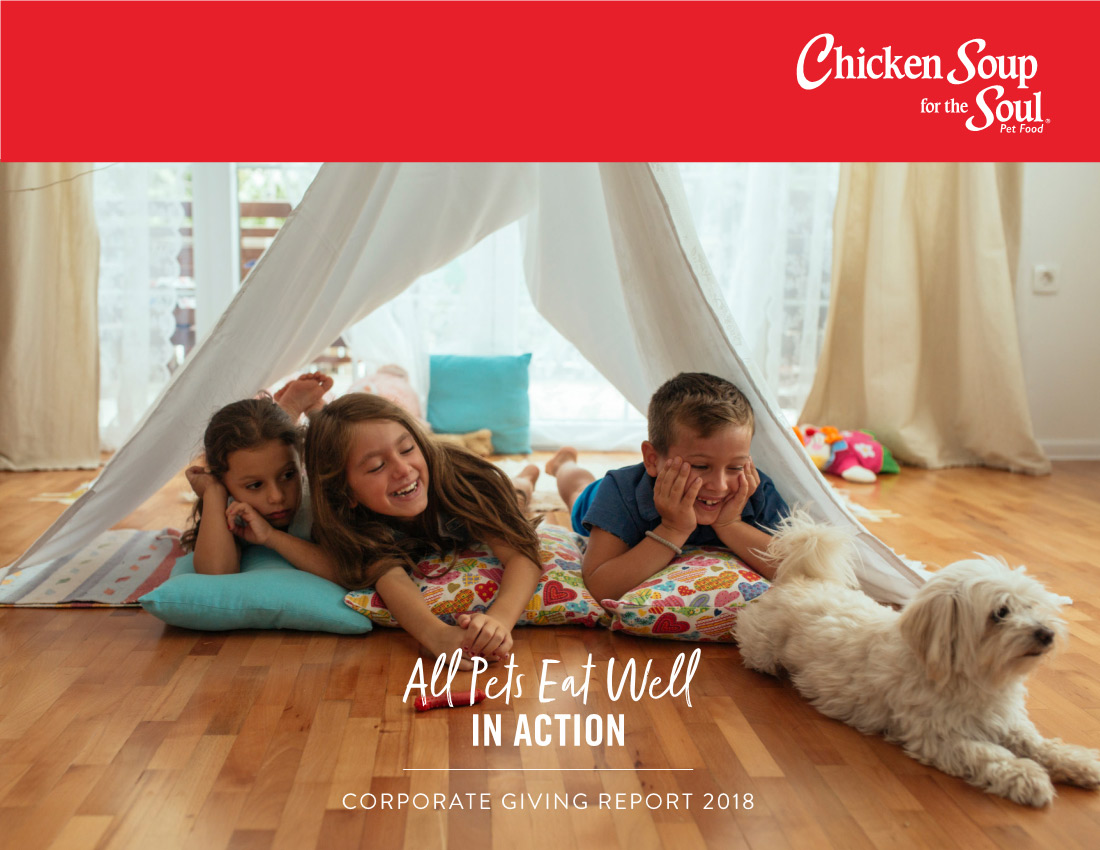 2018 Corporate Report preview image: three children on a hardwood floor, and covered by a tent; a dog is lying down in front of them